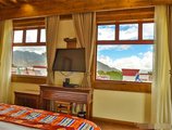 Xuelong Zhuangyuan Hotel в Тибет Китай ✅. Забронировать номер онлайн по выгодной цене в Xuelong Zhuangyuan Hotel. Трансфер из аэропорта.