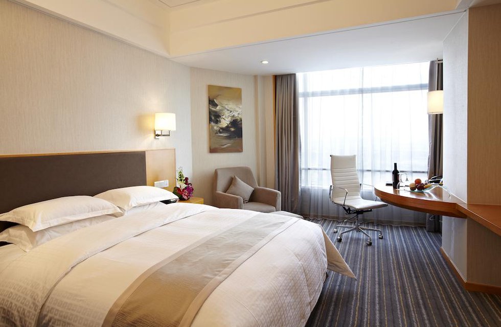 Ramada Plaza Shanghai Pudong Airport в Шанхай Китай ✅. Забронировать номер онлайн по выгодной цене в Ramada Plaza Shanghai Pudong Airport. Трансфер из аэропорта.
