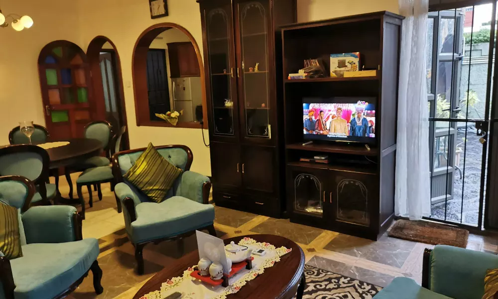 R&G Justlikehome Apartment 1 with blue sofa set and Apartment 2 with Garden View with brown sofa set